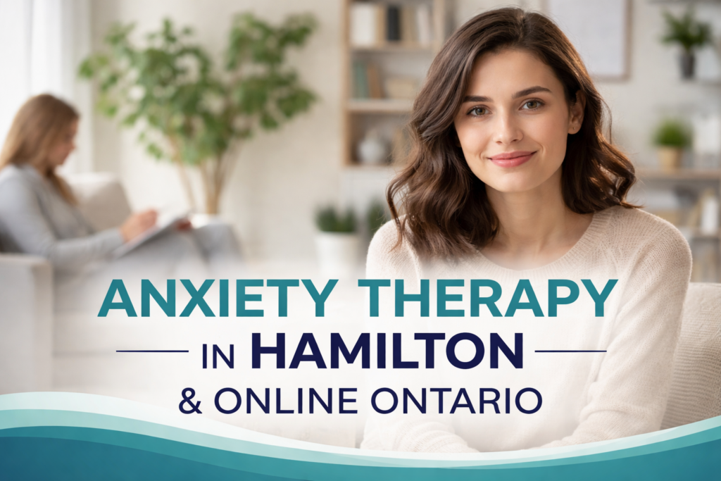 A promotional image for anxiety therapy in Hamilton and online Ontario featuring a smiling woman seated in a calm, modern therapy office. The background shows a softly blurred therapist space with a plant and bookshelf, creating a warm and supportive atmosphere. Large bold text across the image reads “ANXIETY THERAPY IN HAMILTON & ONLINE ONTARIO” in teal and navy tones.